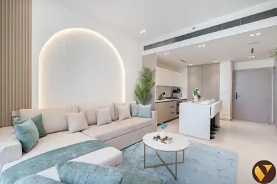 a living room with a couch and a table at Vogue JVC Binghatti Phoenix near Circle Mall, One Bedroom Apartment with Balcony and Access to all Amenities in Dubai
