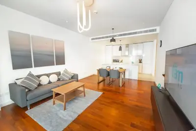 a living room with a couch and a table at Stylish 1BR Stay in City Walk Building 10 in Dubai