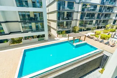 an overhead view of a swimming pool in a apartment building at Stylish 1BR Stay in City Walk Building 10 in Dubai