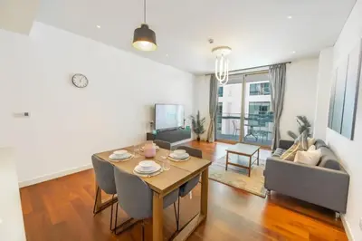a living room with a table and a couch at Stylish 1BR Stay in City Walk Building 10 in Dubai
