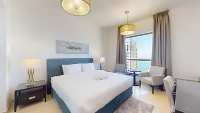 a hotel room with a large bed and a window at Vacationer l Cozy 2 Bed l Breathtaking Sea and Ain Dubai Views in Dubai