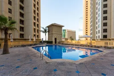 a swimming pool in the middle of a building at Vacationer l Cozy 2 Bed l Breathtaking Sea and Ain Dubai Views in Dubai