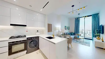 a kitchen with white cabinets and a dishwasher at Vacationer l Elegant 1 Bedroom l Near to Park and Mall l JVC in Dubai