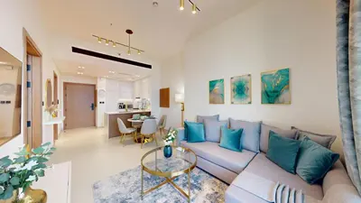 a living room with a couch and a table at Vacationer l Elegant 1 Bedroom l Near to Park and Mall l JVC in Dubai