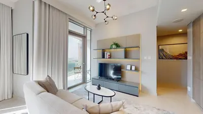 a living room with a couch and a tv at Vacationer l Chic Upgraded Studio l City Views l Dubai Marina in Dubai
