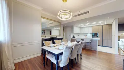 a dining room and kitchen with a table and chairs at Vacationer l Mesmerizing 2 Bed l Sea and Ain Dubai View l JBR in Dubai