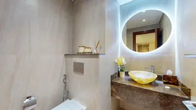 a bathroom with a sink and a mirror at Vacationer l Mesmerizing 2 Bed l Sea and Ain Dubai View l JBR in Dubai