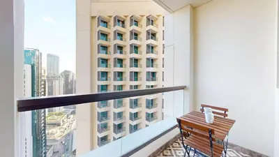 a balcony with a bench and a building at Vacationer l Mesmerizing 2 Bed l Sea and Ain Dubai View l JBR in Dubai