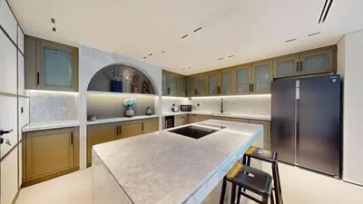 a kitchen with a counter and a refrigerator at Vacationer l Premium 2 Bedroom l Business Bay l Prime Location in Dubai