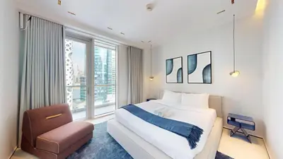 a bedroom with a large bed and a window at Vacationer l Premium 2 Bedroom l Business Bay l Prime Location in Dubai