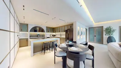 a kitchen and living room with a table and chairs at Vacationer l Premium 2 Bedroom l Business Bay l Prime Location in Dubai