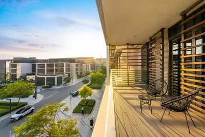 a balcony with a view of a city street at Elegant 3BR with Maids Room City Walk Dubai in Dubai
