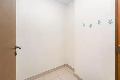 a room with a white wall and a door at Stylish 2BR with Maids Room City Walk in Dubai