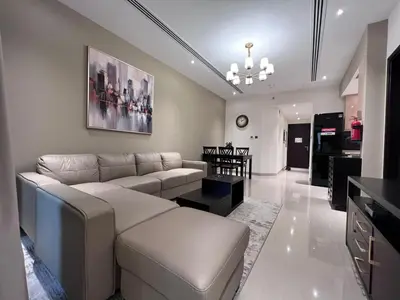 a living room with a couch and a table at Elite Residence 1, Downtown Dubai in Dubai