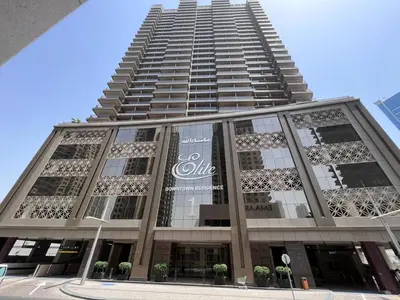 a tall building with a sign on the side of it at Elite Residence 1, Downtown Dubai in Dubai