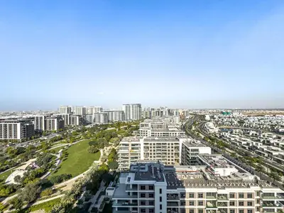 an aerial view of a city with tall buildings at Superhost - 1BR Apartment, Balcony, Pool & Gym , Dubai Hills in Dubai
