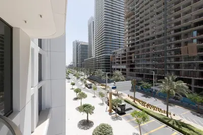 an overhead view of a city street with trees and buildings at Luxury & Modern Unit in Emaar Beachfront in Dubai