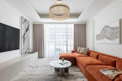 a living room with a couch and a table at Luxury & Modern Unit in Emaar Beachfront in Dubai