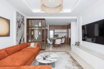 a living room with a couch and a table at Luxury & Modern Unit in Emaar Beachfront in Dubai
