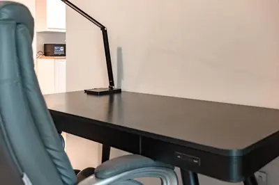a black desk with a lamp on top of it at Sulafa Tower, Dubai Marina - Onelink in Dubai