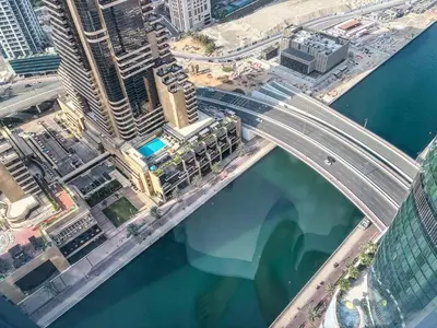 an aerial view of a bridge over the water at Cayan Tower, Dubai Marina - Onelink in Dubai