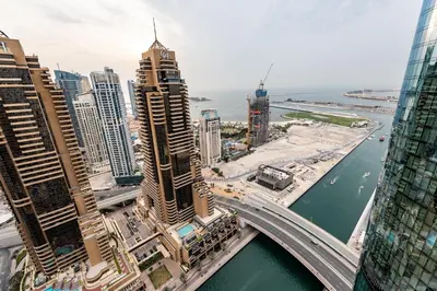an aerial view of a city with a bridge at Cayan Tower, Dubai Marina - Onelink in Dubai