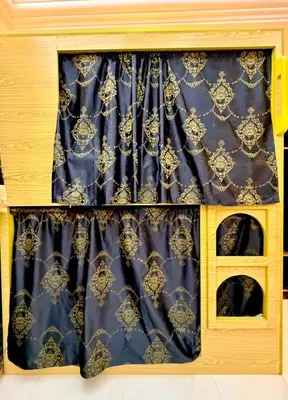 a window with a blue and gold curtain at Risephoenix Japanese Luxury Capsule Villa - Dubai in Dubai