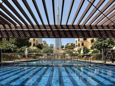 a large swimming pool with a canopy over it at Silkhaus in Al Tajer in Souk al Bahar Direct Access in Dubai