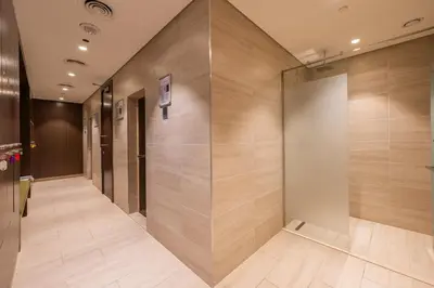 a hallway with a row of elevators in a building at Family Friendly Studio in Dubai City Views Pool Free Parking in Dubai