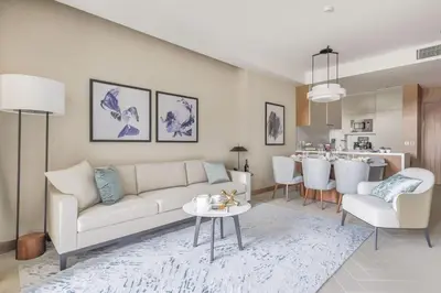 a living room with a white couch and a table at Luxury 1 & 2 Bed Apartments at THE ADDRESS RESIDENCES OPERA in Dubai by Other House V H LLC in Dubai