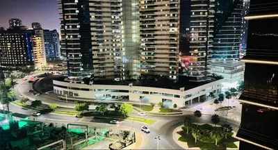 an aerial view of a city at night with buildings at Royal Budget Stay Dubai In Tecom Near Metro in Dubai