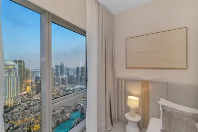 a hotel room with a view of a city at Full Burj Khalifa & Fountain View 60th Floor Sky Luxury 2BHK 4 mins Walk to Dubai Mall Downtown in Dubai