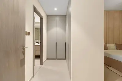 a hallway with a door leading to a bedroom at Full Burj Khalifa & Fountain View 60th Floor Sky Luxury 2BHK 4 mins Walk to Dubai Mall Downtown in Dubai