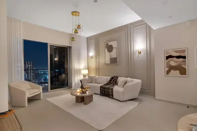 a living room with a couch and a table at Full Burj Khalifa & Fountain View 60th Floor Sky Luxury 2BHK 4 mins Walk to Dubai Mall Downtown in Dubai