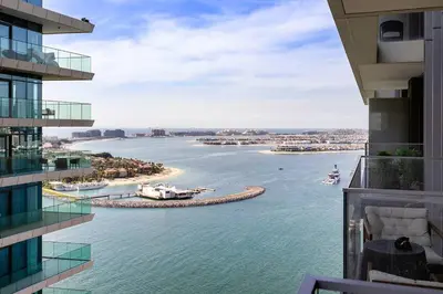 a view of the water from a building at Beachfront 1BR Retreat Beach Isle Tower 01 in Dubai