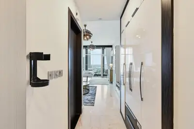 a hallway of a house with white walls at Bloomfields STU in Business Bay, Bayz by Danube in Dubai