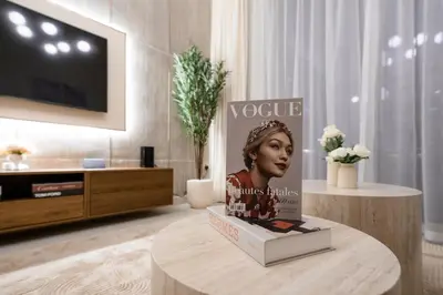 a statue of a woman on a table in a living room at Stylish 2BR Connected to Dubai Mall with Full Burj Khalifa View in Dubai