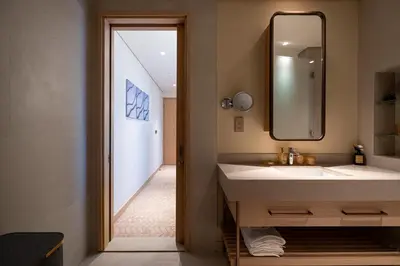 a bathroom with a sink and a mirror at Stylish 2BR Connected to Dubai Mall with Full Burj Khalifa View in Dubai