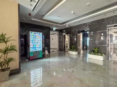 a large lobby with a large screen in a building at Frank Porter - Hera Tower in Dubai