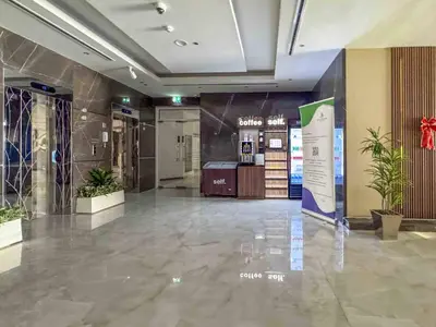 a lobby with a display in the middle of a building at Frank Porter - Hera Tower in Dubai