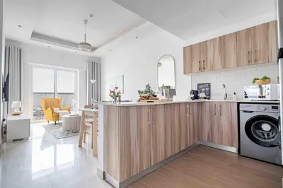 a kitchen with a washer and dryer in a room at Frank Porter - Hera Tower in Dubai