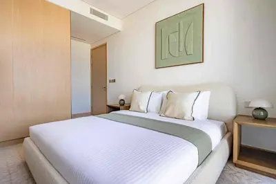 a bedroom with a large white bed in it at Frank Porter - Vida Dubai Mall, Downtown in Dubai