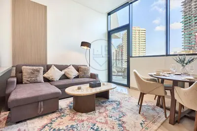 a living room with a couch and a table at Binghatti Royale premium 1BR with Jacuzzi in Dubai