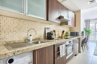 a kitchen with a sink and a counter top at Frank Porter - Goldcrest Executive in Dubai
