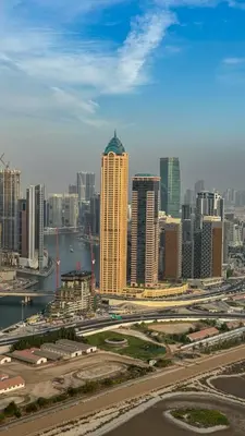 a view of a city with a river and buildings at High floor studio with stunning views in Aykon City in Dubai