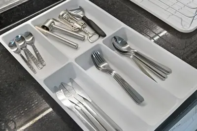 a white tray with silver utensils on a table at Bloomfields Stunning STU, Elz By Danube, Dubai in Dubai