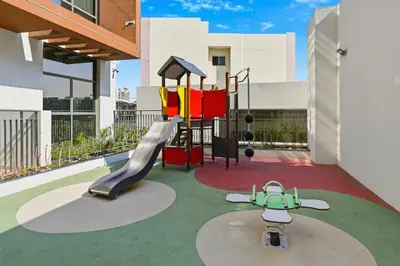 a childrens playground with a slide and a slideintend at Bloomfields Stunning STU, Elz By Danube, Dubai in Dubai