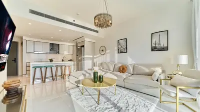 a living room with a couch and a table at Prime 3BR Maid Sunrise Bay Ain Dubai Palm View in Dubai