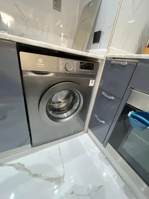 a washer and dryer in a small room at Luxurious full renovated apartment in Dubai