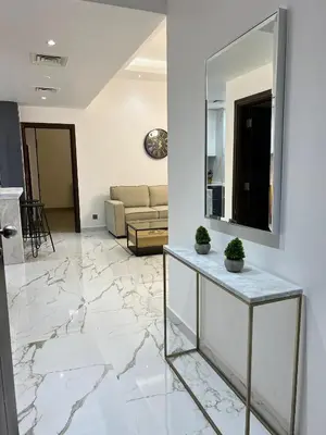 a living room with marble floors and a mirror at Luxurious full renovated apartment in Dubai